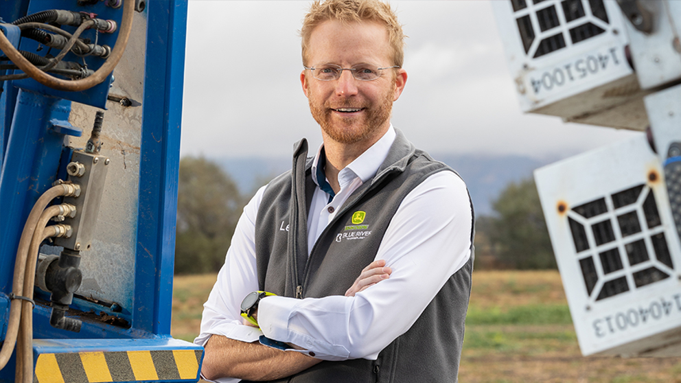 Lee Redden standing in front of equipment
